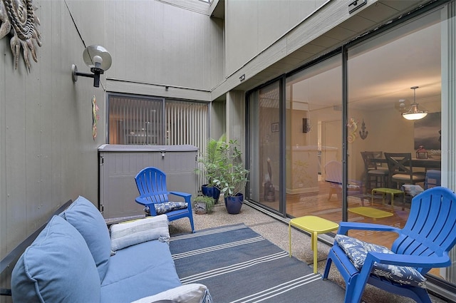 view of patio / terrace with a jacuzzi and an outdoor living space