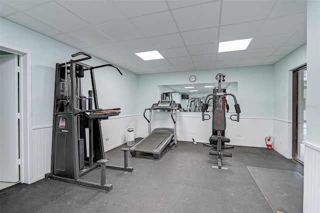 exercise area with a paneled ceiling