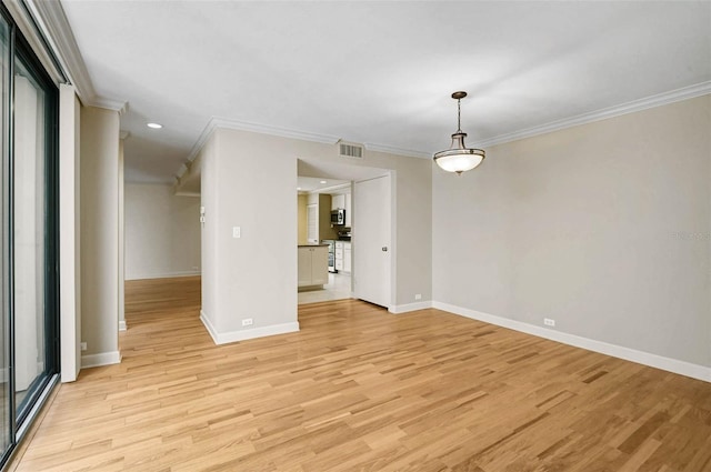 304 Pine Run Dr, Osprey, FL 34229 - spare room with crown molding, baseboards, light wood finished floors, and recessed lighting
