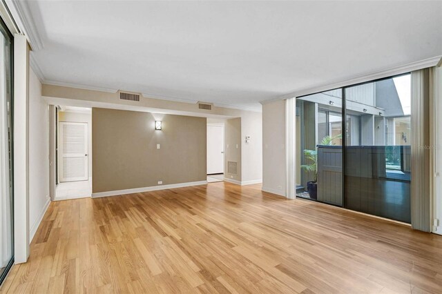 304 Pine Run Dr, Osprey, FL 34229 - empty room featuring ornamental molding, light wood-type flooring, and baseboards