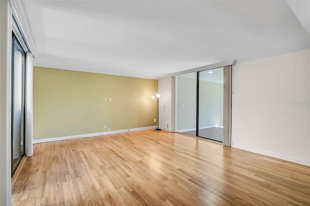 304 Pine Run Dr, Osprey, FL 34229 - unfurnished room with light wood-type flooring, crown molding, and baseboards