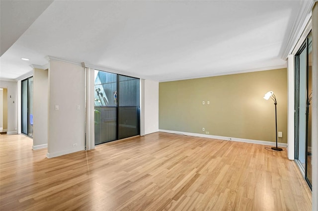 304 Pine Run Dr, Osprey, FL 34229 - spare room featuring ornamental molding, light wood-type flooring, and baseboards