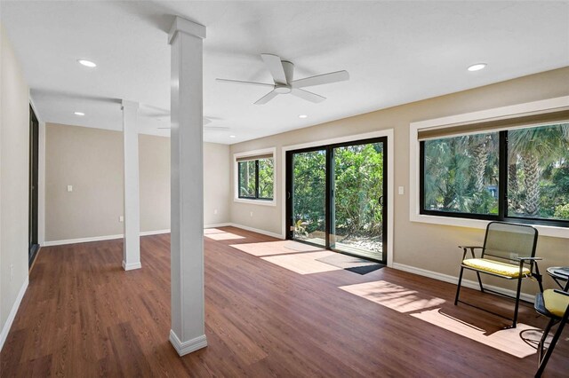 304 Pine Run Dr, Osprey, FL 34229 - unfurnished living room with ornate columns, wood finished floors, ceiling fan, baseboards, and recessed lighting