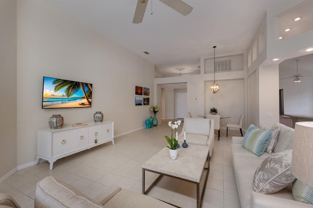 tiled living room featuring ceiling fan