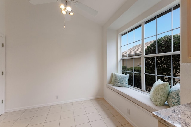 unfurnished room with ceiling fan and light tile patterned floors