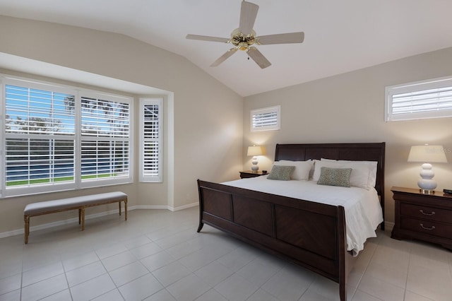 bedroom with ceiling fan, light tile patterned flooring, and vaulted ceiling