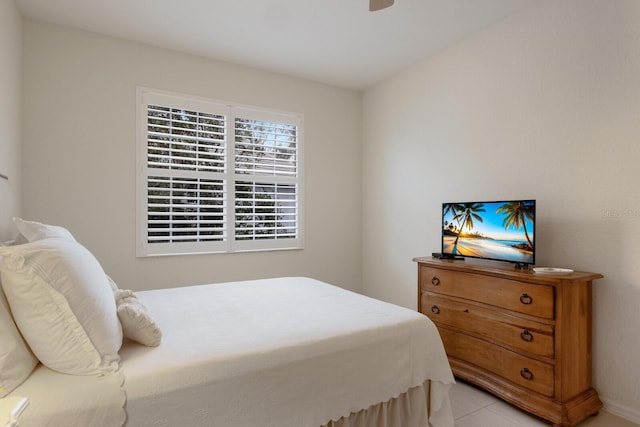 bedroom featuring ceiling fan and light tile patterned flooring