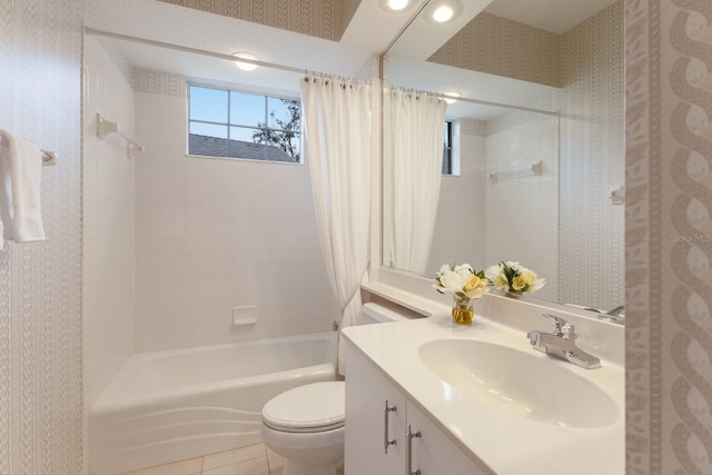 full bathroom with toilet, tile patterned flooring, vanity, and shower / bath combo with shower curtain