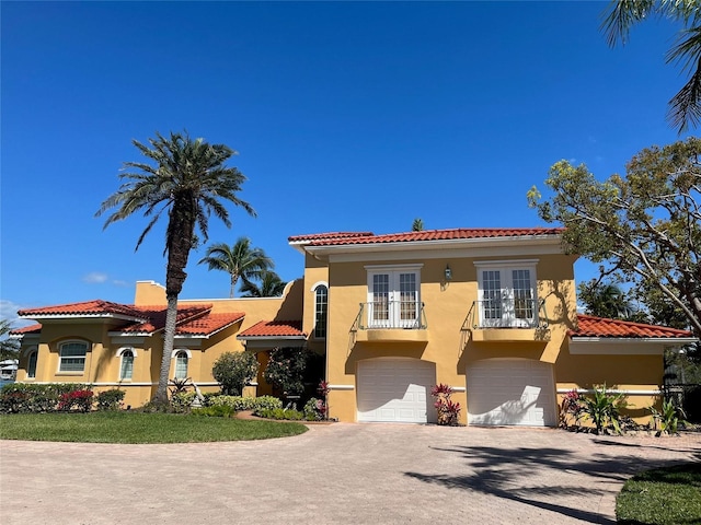 mediterranean / spanish-style home featuring a balcony