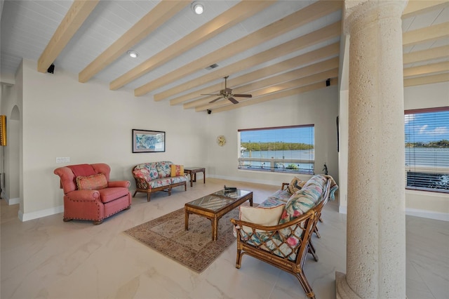 living room with ceiling fan and beam ceiling