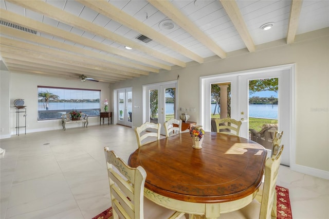 dining space featuring wood ceiling, beamed ceiling, french doors, a water view, and ceiling fan