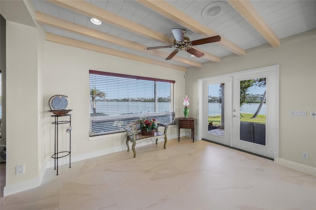 doorway with a water view, a wealth of natural light, french doors, and beamed ceiling