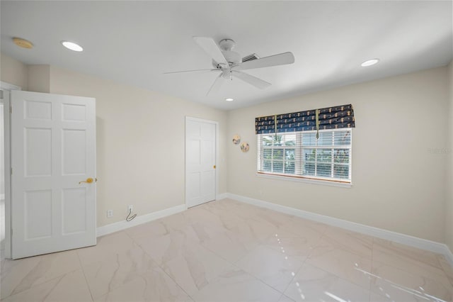 unfurnished room featuring ceiling fan