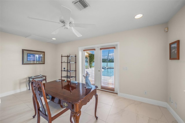 dining room featuring ceiling fan and french doors