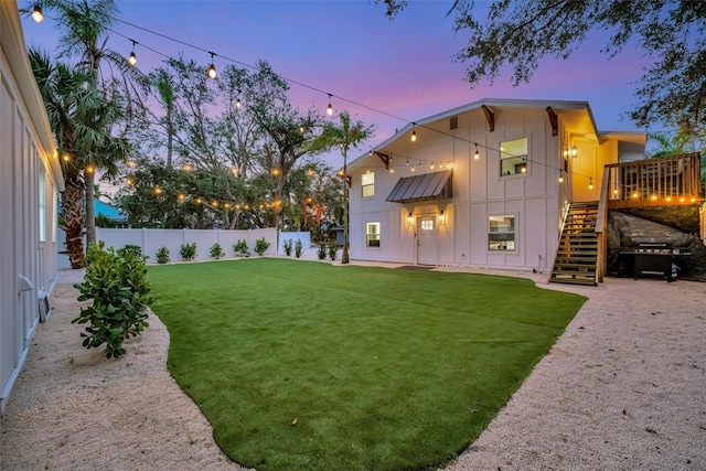 view of yard at dusk