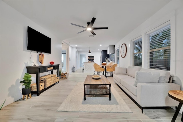 living room with ceiling fan