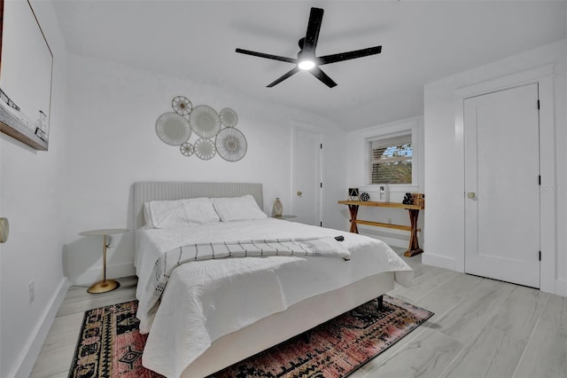 bedroom featuring ceiling fan and vaulted ceiling