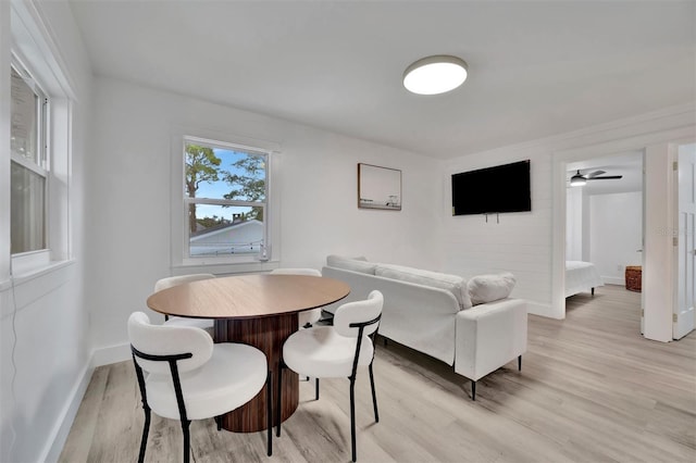 dining area featuring ceiling fan and light hardwood / wood-style floors