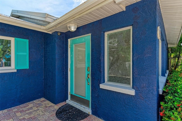 entrance to property with a patio area