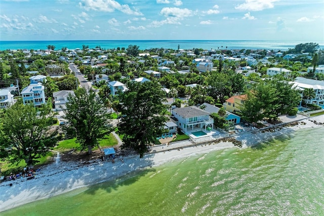 aerial view featuring a water view and a view of the beach