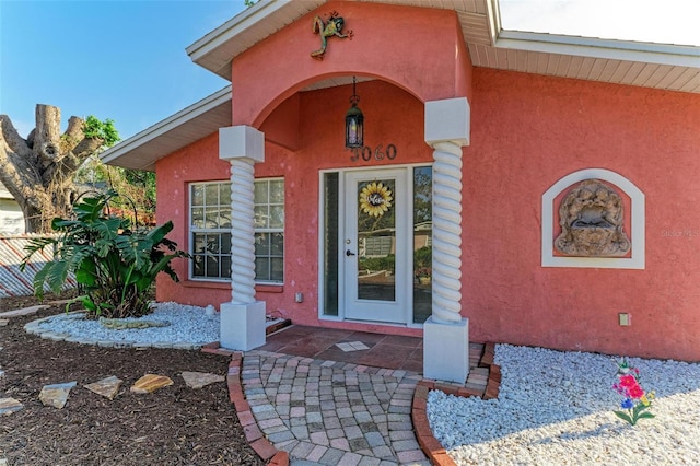 property entrance featuring a patio area