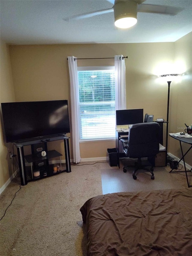 bedroom with light colored carpet and ceiling fan