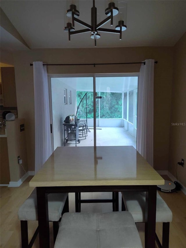 15900 SW 19th Avenue Rd, Ocala, FL 34473 - dining space featuring a chandelier and light wood-type flooring