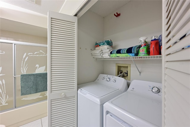 laundry room featuring washing machine and clothes dryer