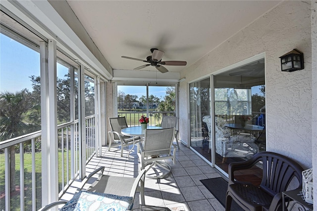 sunroom / solarium with ceiling fan