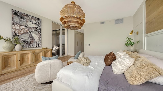 bedroom with a closet and light hardwood / wood-style flooring