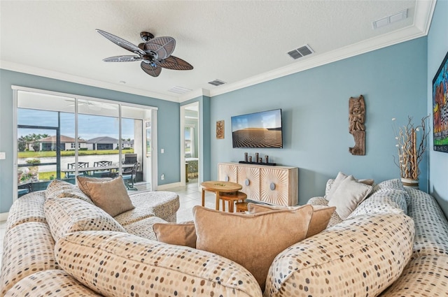 tiled living room featuring ceiling fan, crown molding, and a textured ceiling