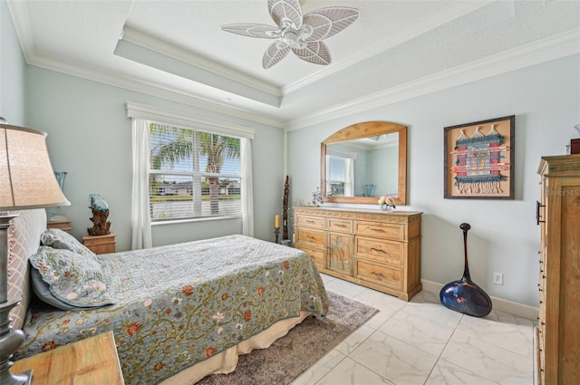 bedroom featuring a raised ceiling, ceiling fan, and ornamental molding