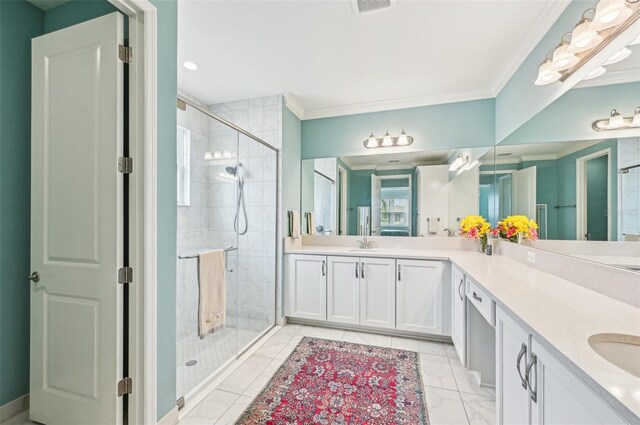 bathroom with a shower with door, tile patterned flooring, crown molding, and vanity