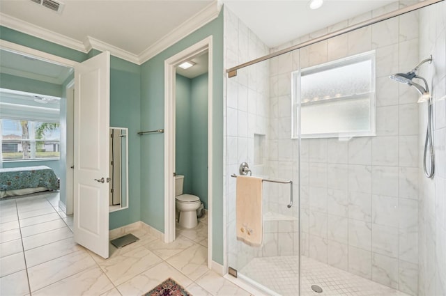 bathroom featuring ornamental molding, a shower with shower door, and toilet