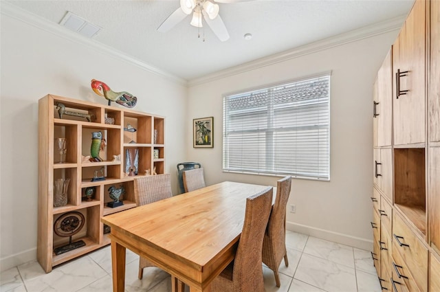 dining space featuring ceiling fan and crown molding