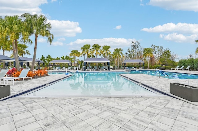 view of swimming pool with a gazebo and a patio area