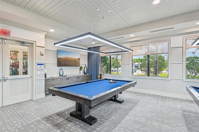 game room featuring billiards, wooden ceiling, and light carpet