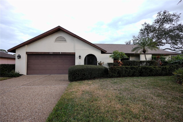 ranch-style house with a front lawn and a garage