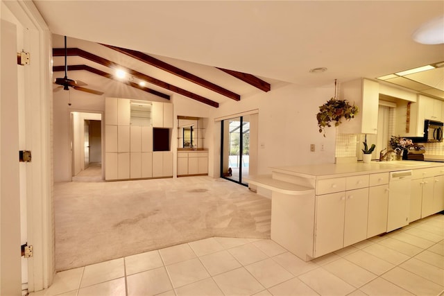 kitchen with stainless steel range with electric stovetop, light colored carpet, vaulted ceiling with beams, dishwasher, and white cabinets