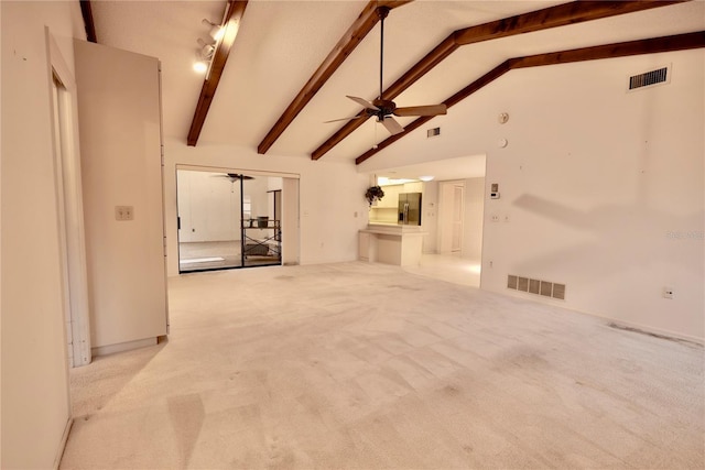 unfurnished living room with light carpet, ceiling fan, beam ceiling, and high vaulted ceiling