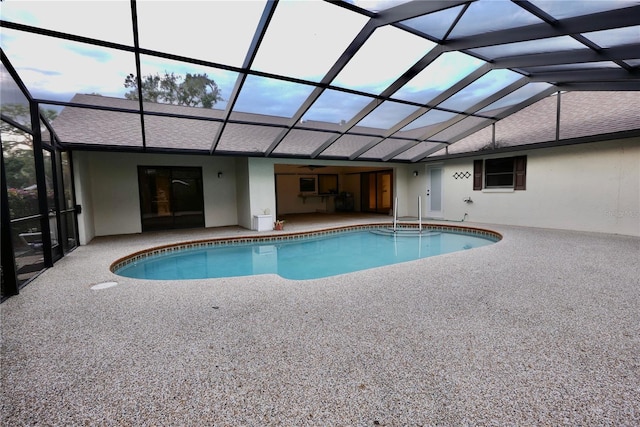 view of pool with a lanai and a patio area