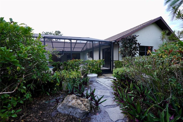 view of front of house with glass enclosure