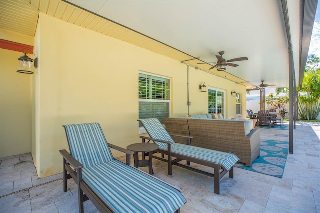 view of patio / terrace featuring ceiling fan and an outdoor living space