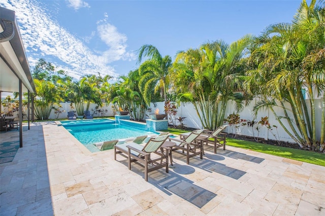 view of swimming pool featuring a patio area