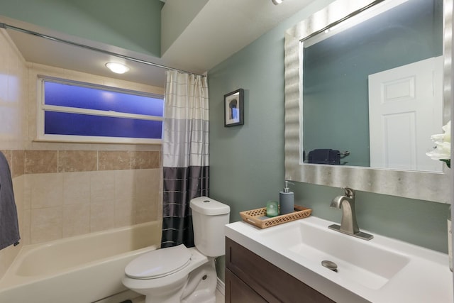 full bathroom with shower / tub combo with curtain, vanity, and toilet