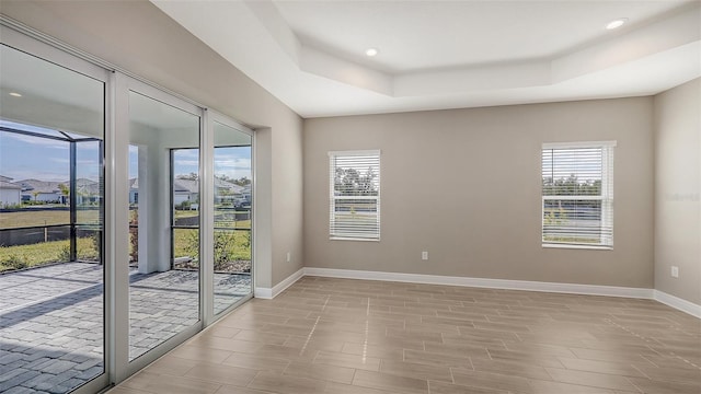 empty room with a raised ceiling