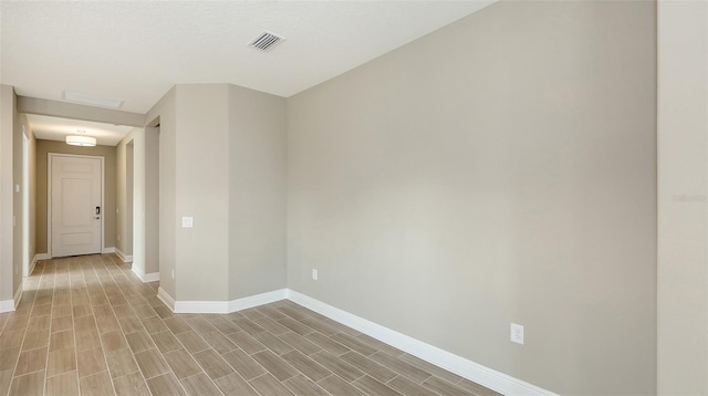 spare room featuring a textured ceiling