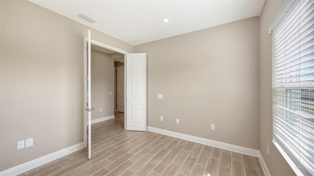 spare room featuring light hardwood / wood-style floors