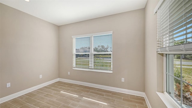 unfurnished room featuring a healthy amount of sunlight