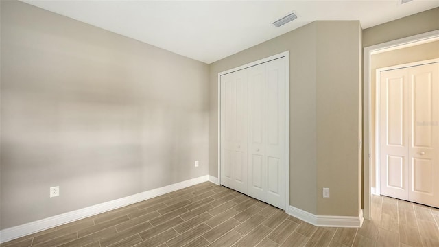 unfurnished bedroom featuring a closet